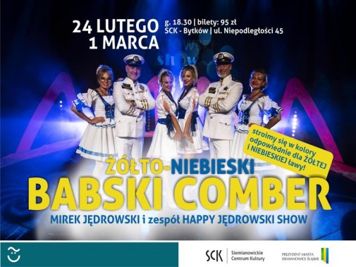 Granatowe tło i kolorowe światła sceniczne. Na ich tle stoi 6 osobowy zespół Happy Jędrowski Show…